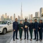 Tour guides standing by vehicles