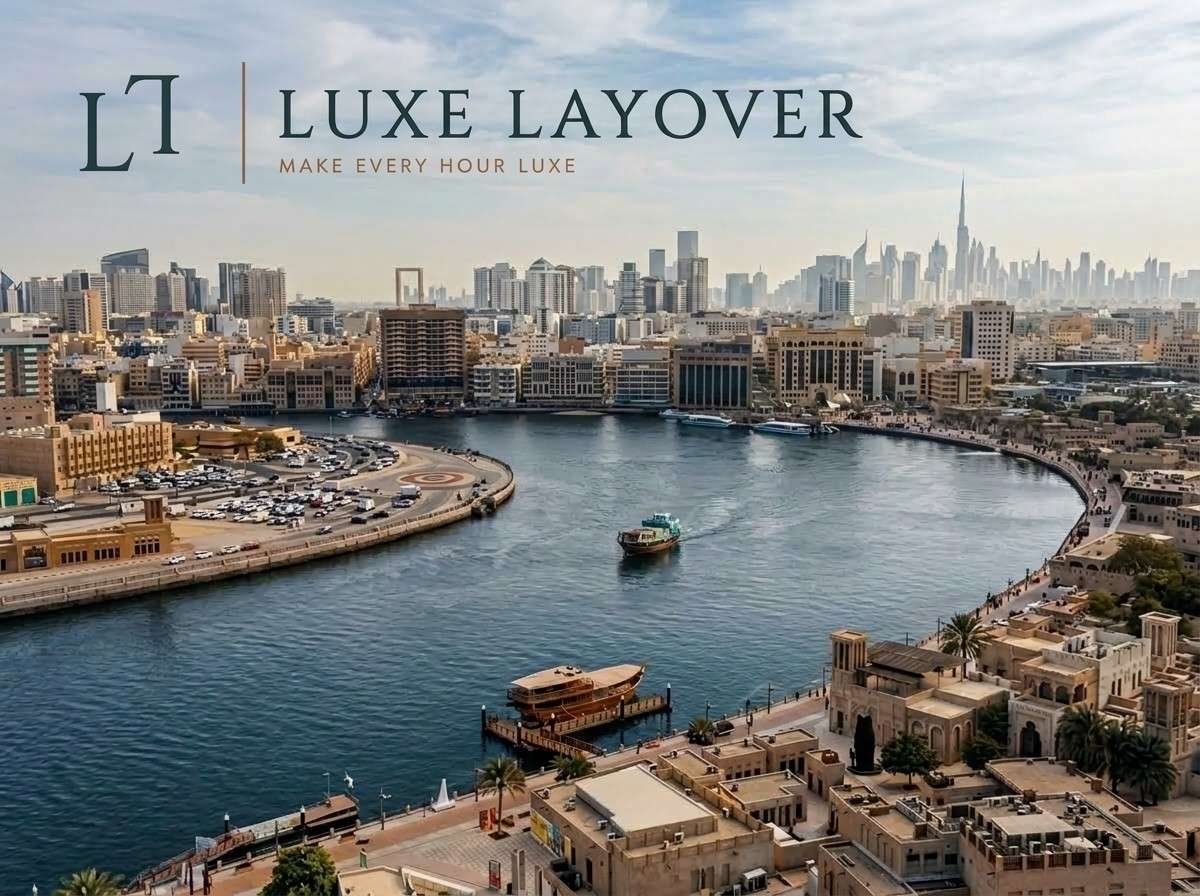 Aerial view of Dubai Creek's historic waterfront district with the modern skyline visible beyond