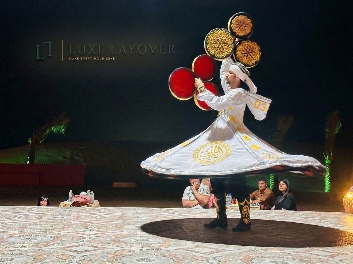 A whirling Tanoura dance performer in colourful spinning skirts performing at night