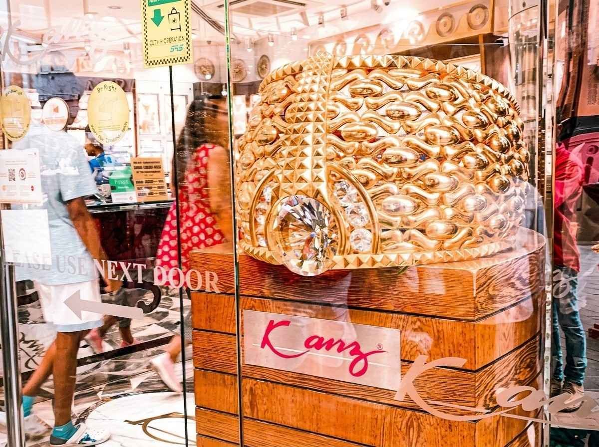 A gold souq storefront window displaying elaborate gold jewellery