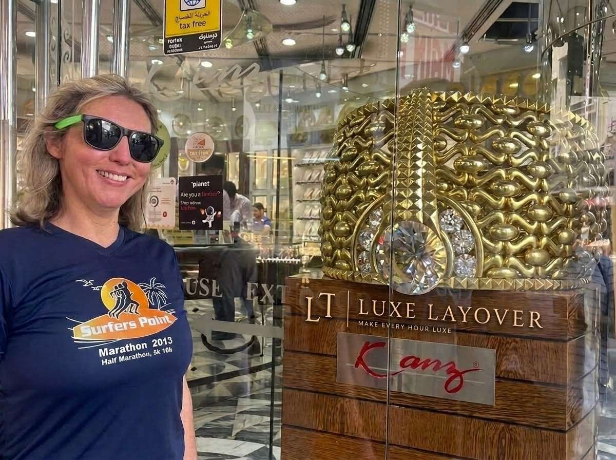 A tourist browsing gold jewellery displays in the Dubai Gold Souq